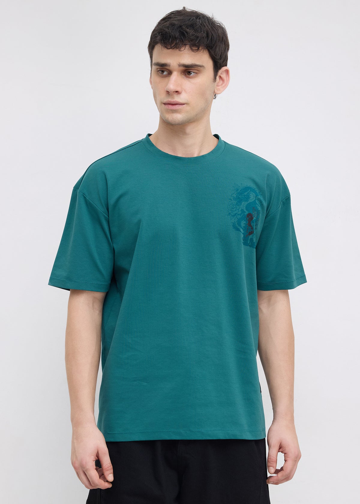 Geruge Tonal Graphic Oversized T-shirt: Bottle Green