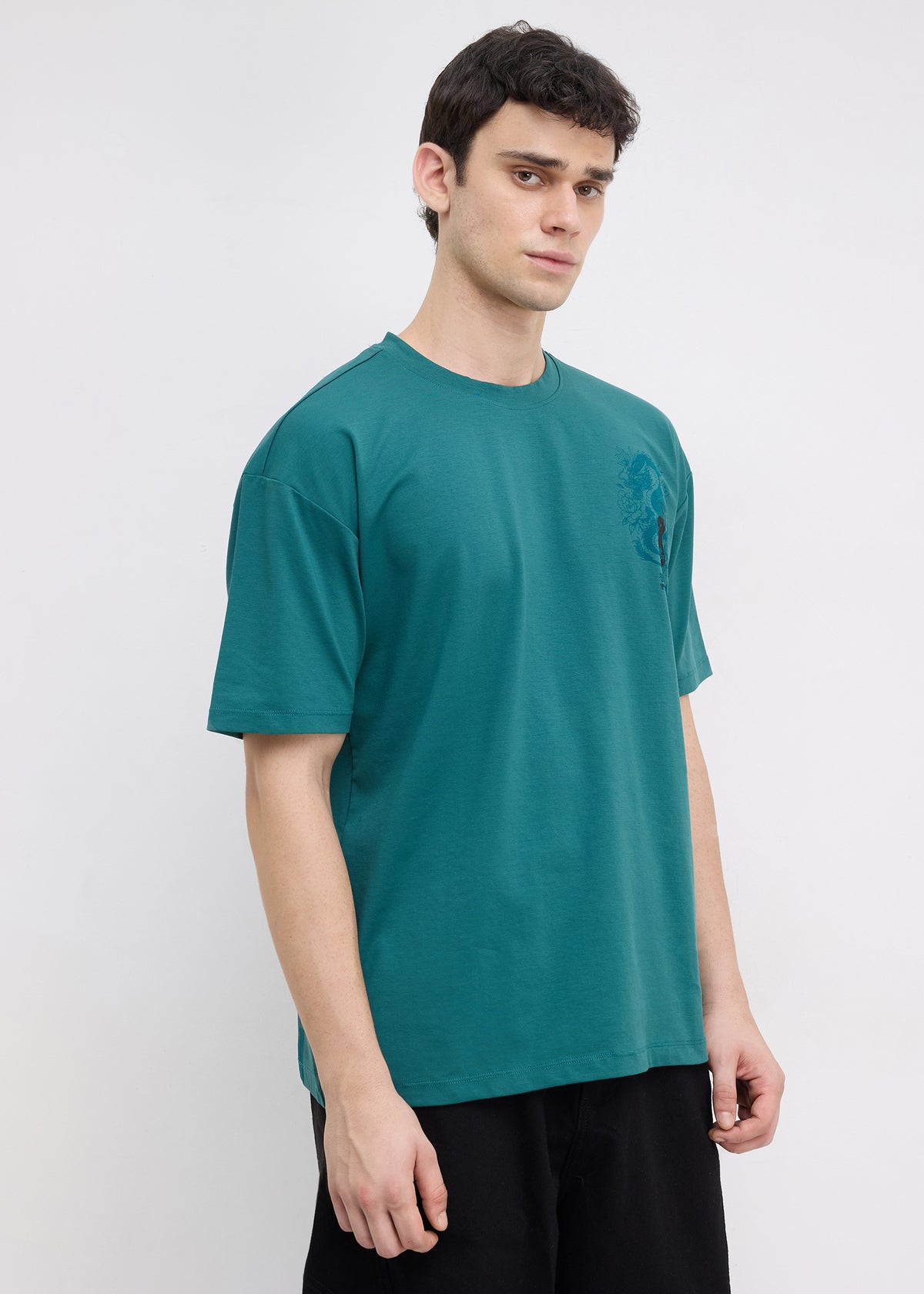 Geruge Tonal Graphic Oversized T-shirt: Bottle Green