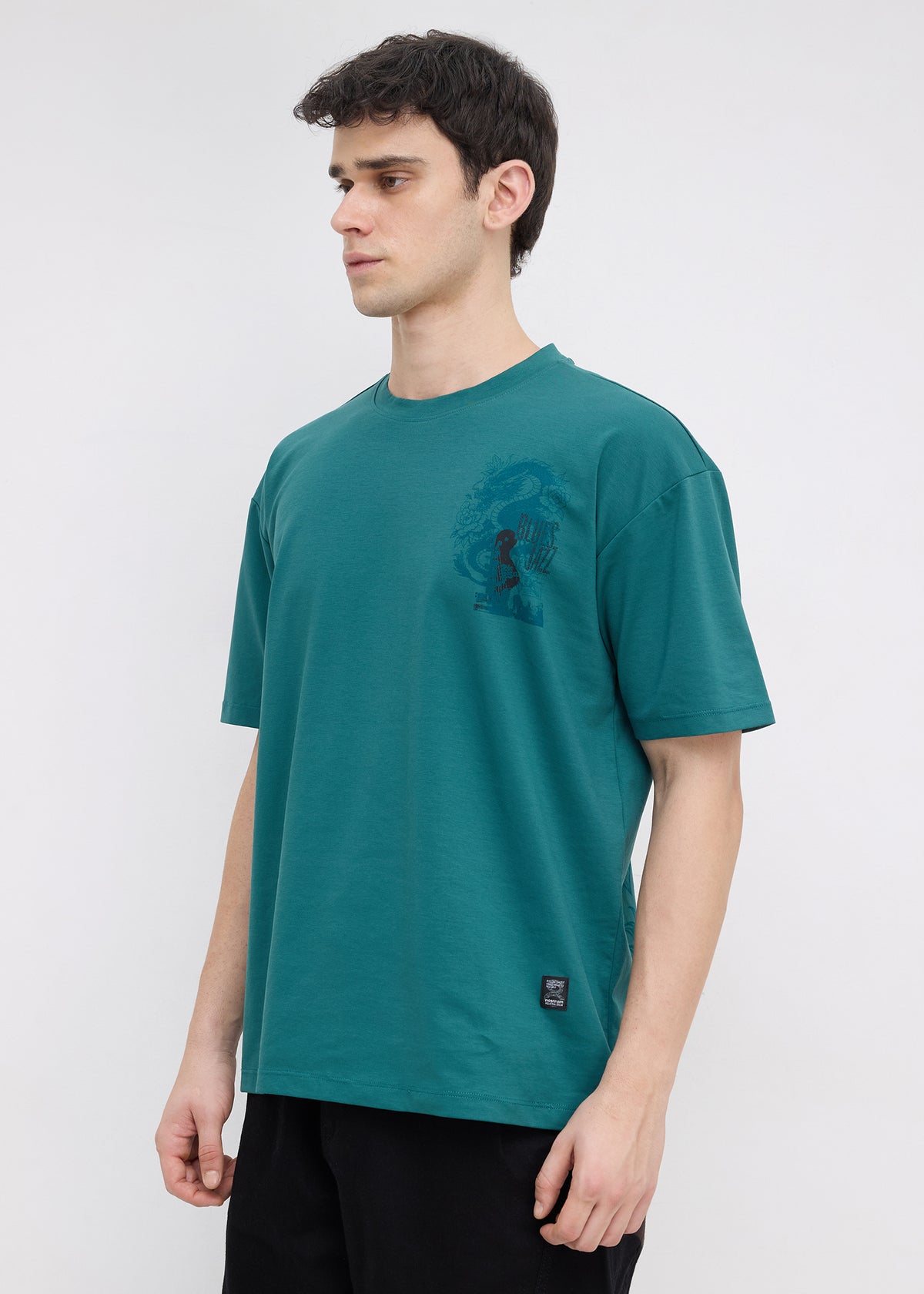 Geruge Tonal Graphic Oversized T-shirt: Bottle Green